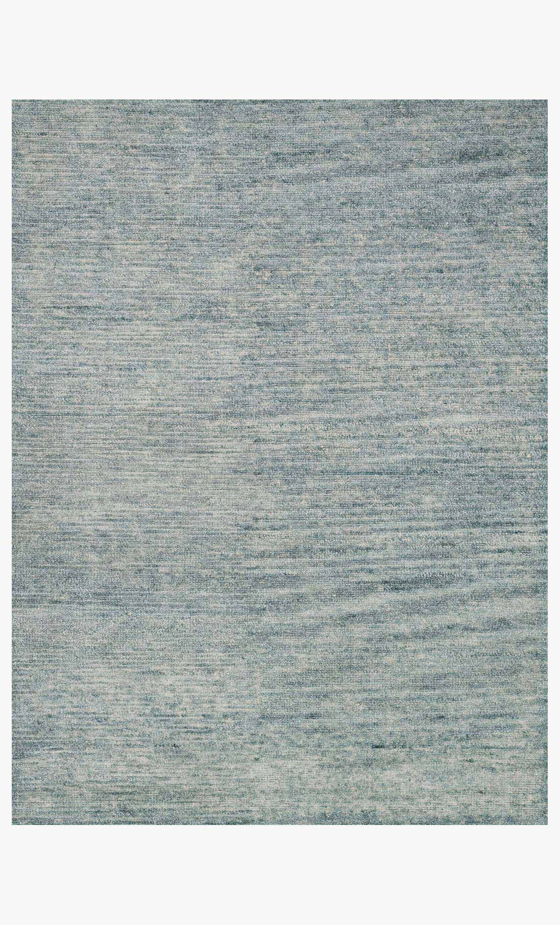 Hand-knotted transitional rug, sea blue with subtle speckled pattern, rectangular shape.