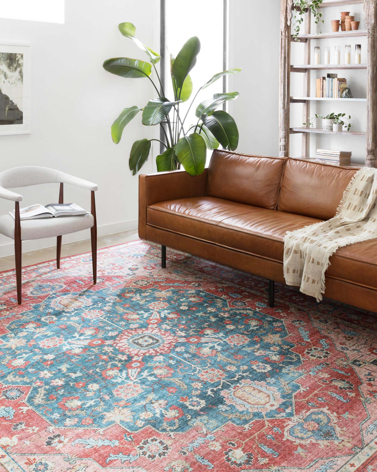 Brick and ocean vintage-style rug covering the living room floor with detailed pattern