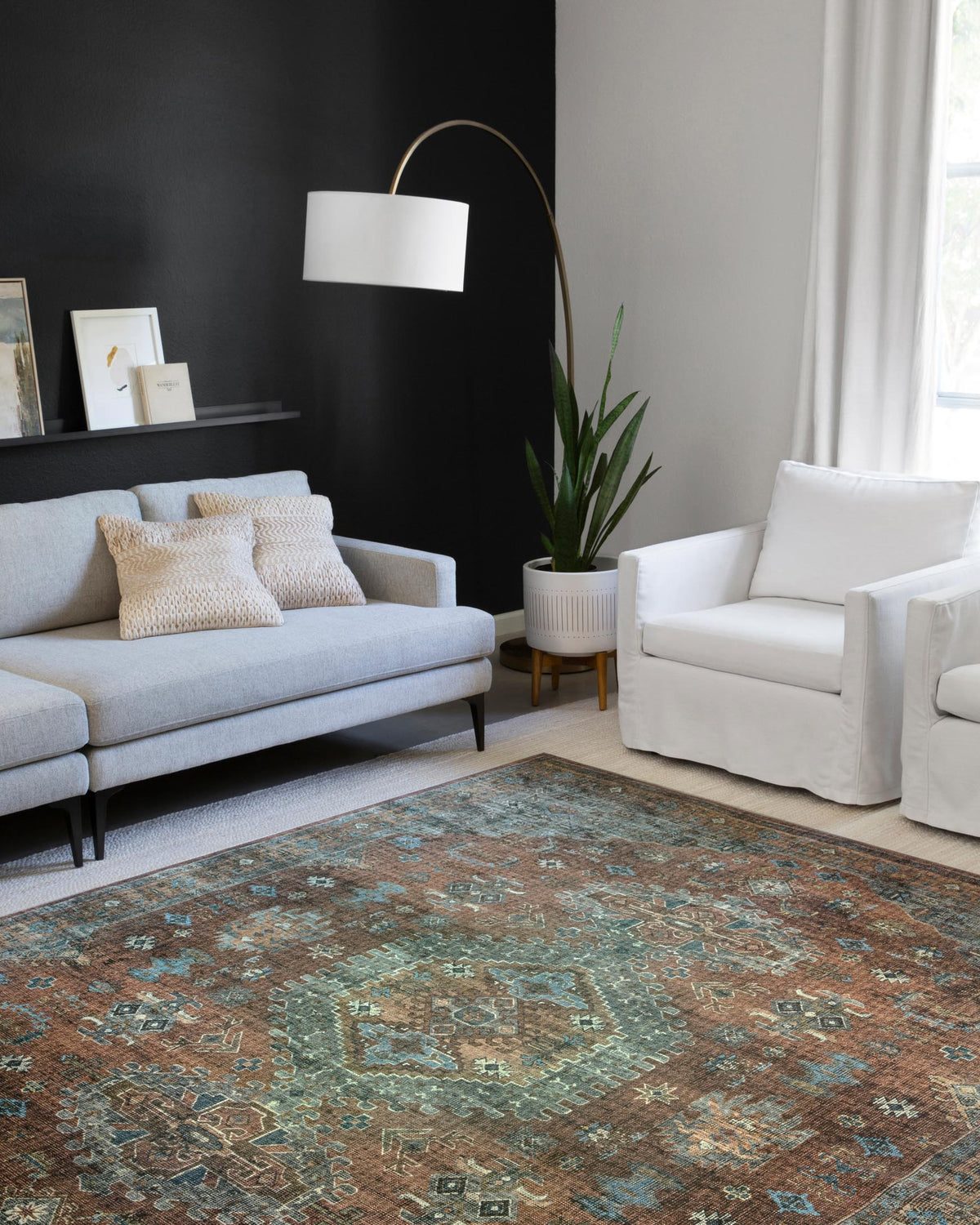 Terracotta and sky geometric medallion rug with detailed border, flat on the floor