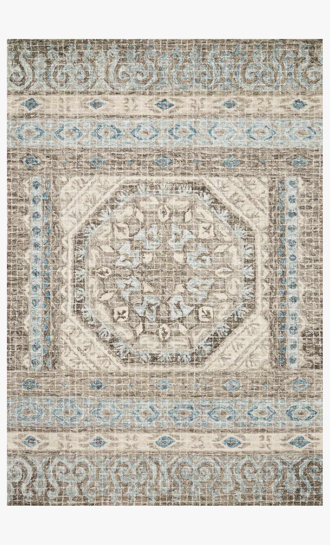 Transitional hooked rug with octagon medallion, stone base and blue accents, close-up
