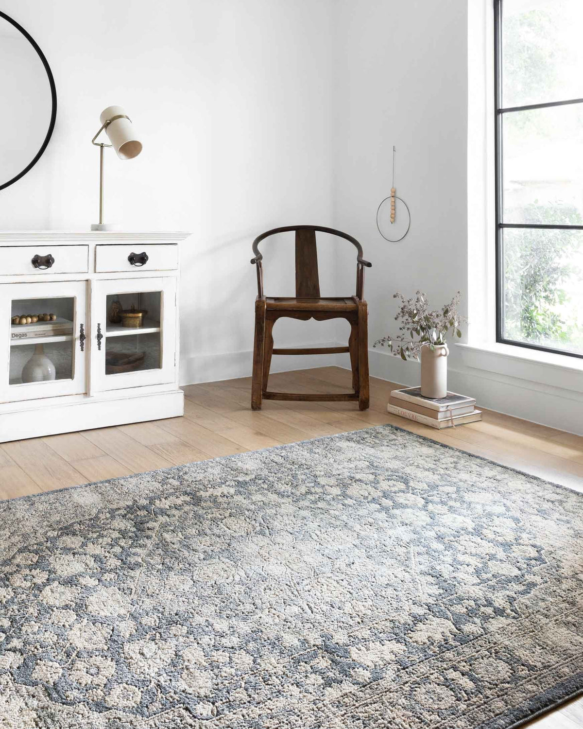 Loloi II Teagan Collection power loomed rug in denim and mist with distressed floral medallion