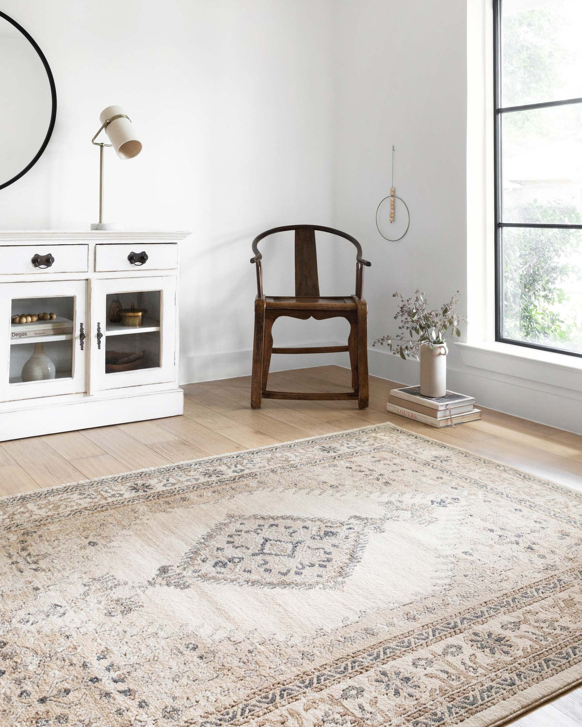 Large oatmeal and ivory rug with bordered medallion design in blue-gray tones