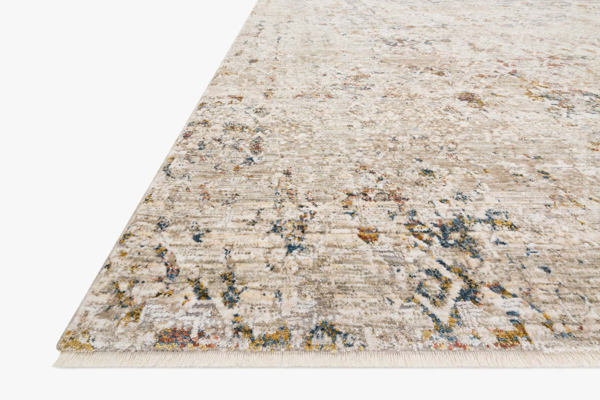 Corner view of traditional power-loomed rug, ivory with blue and rust multicolor accents