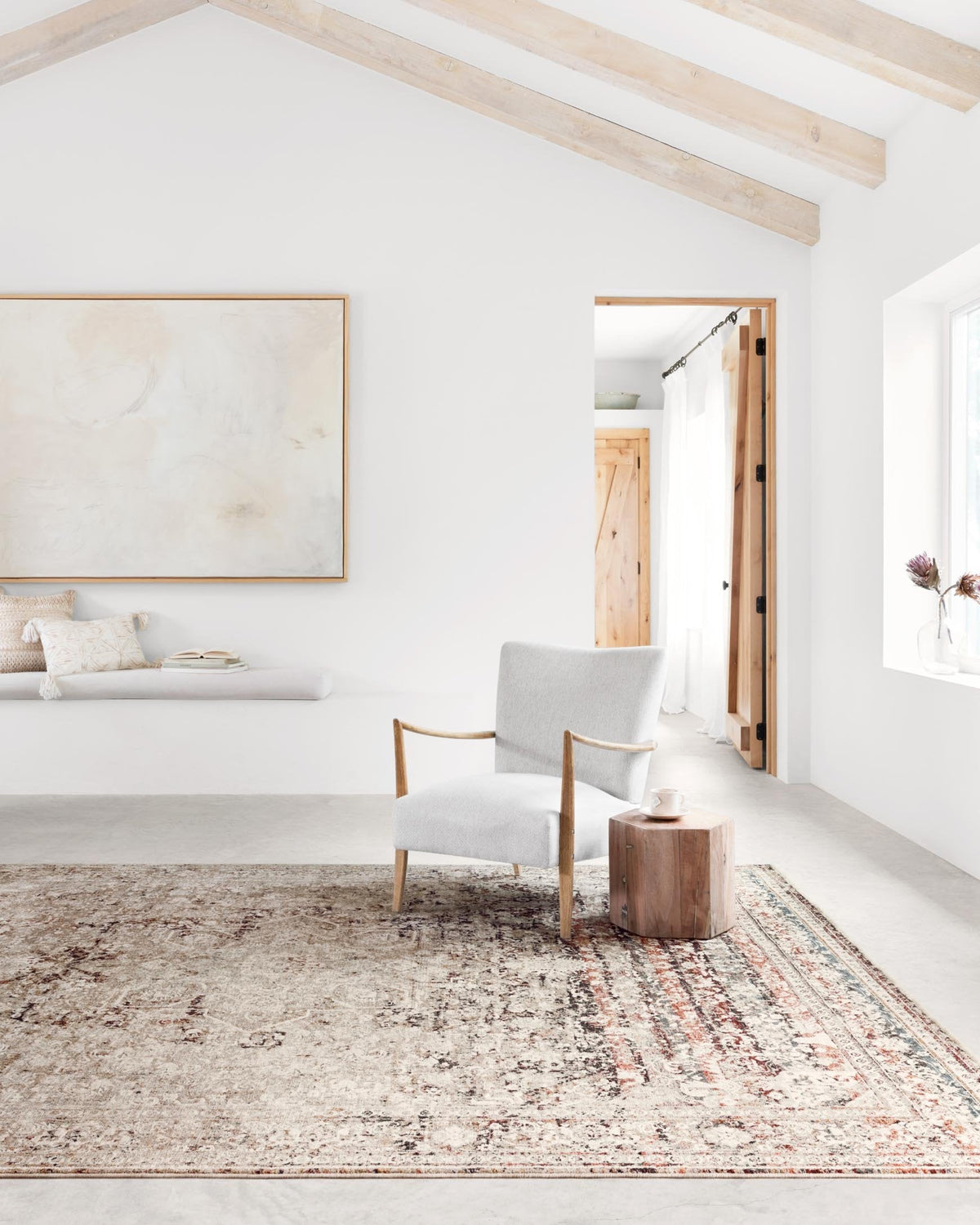 Traditional power-loomed rug with distressed medallion pattern in taupe, ivory, and brick.