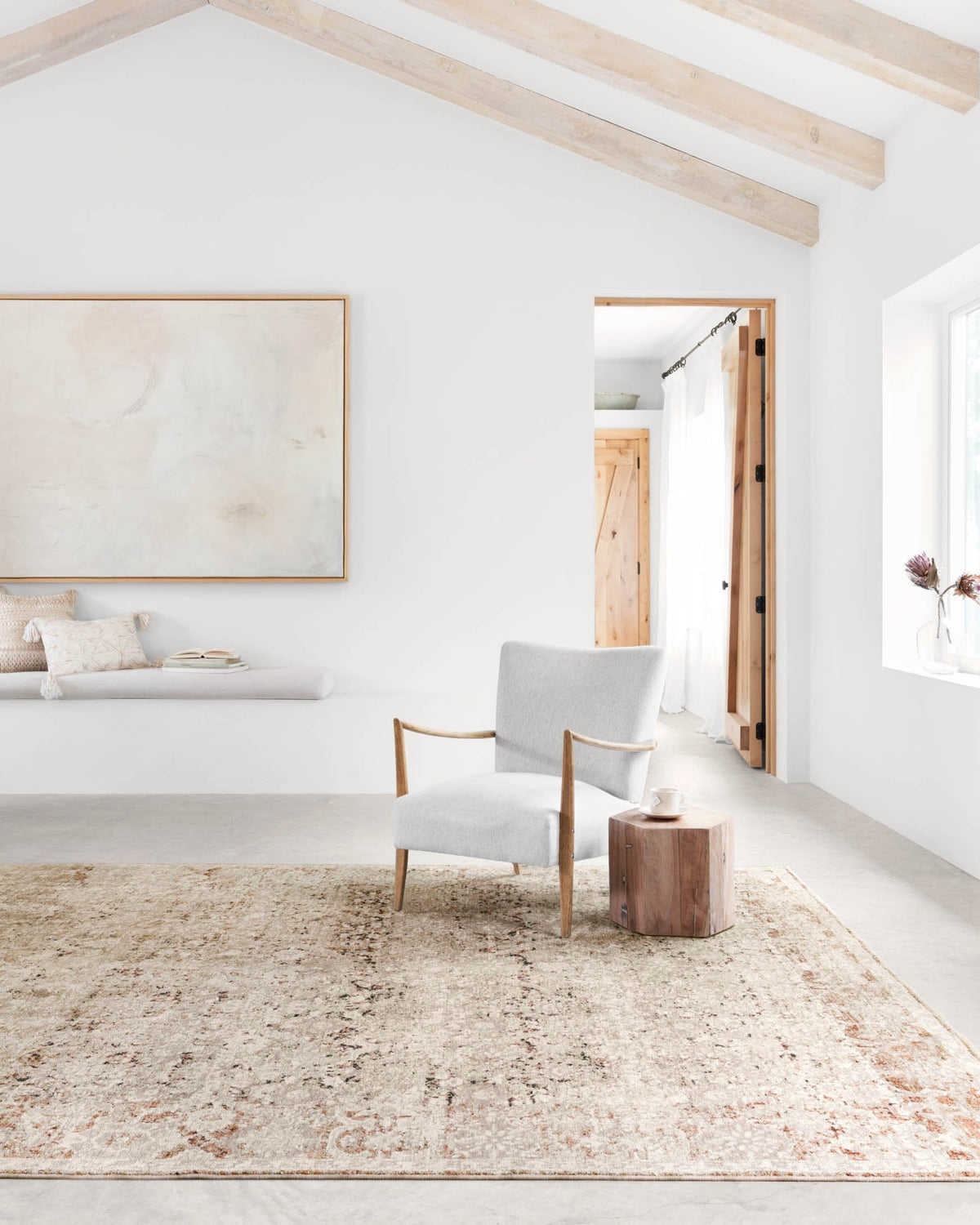 Natural and rust abstract rug with short fringe and textured pile, corner view