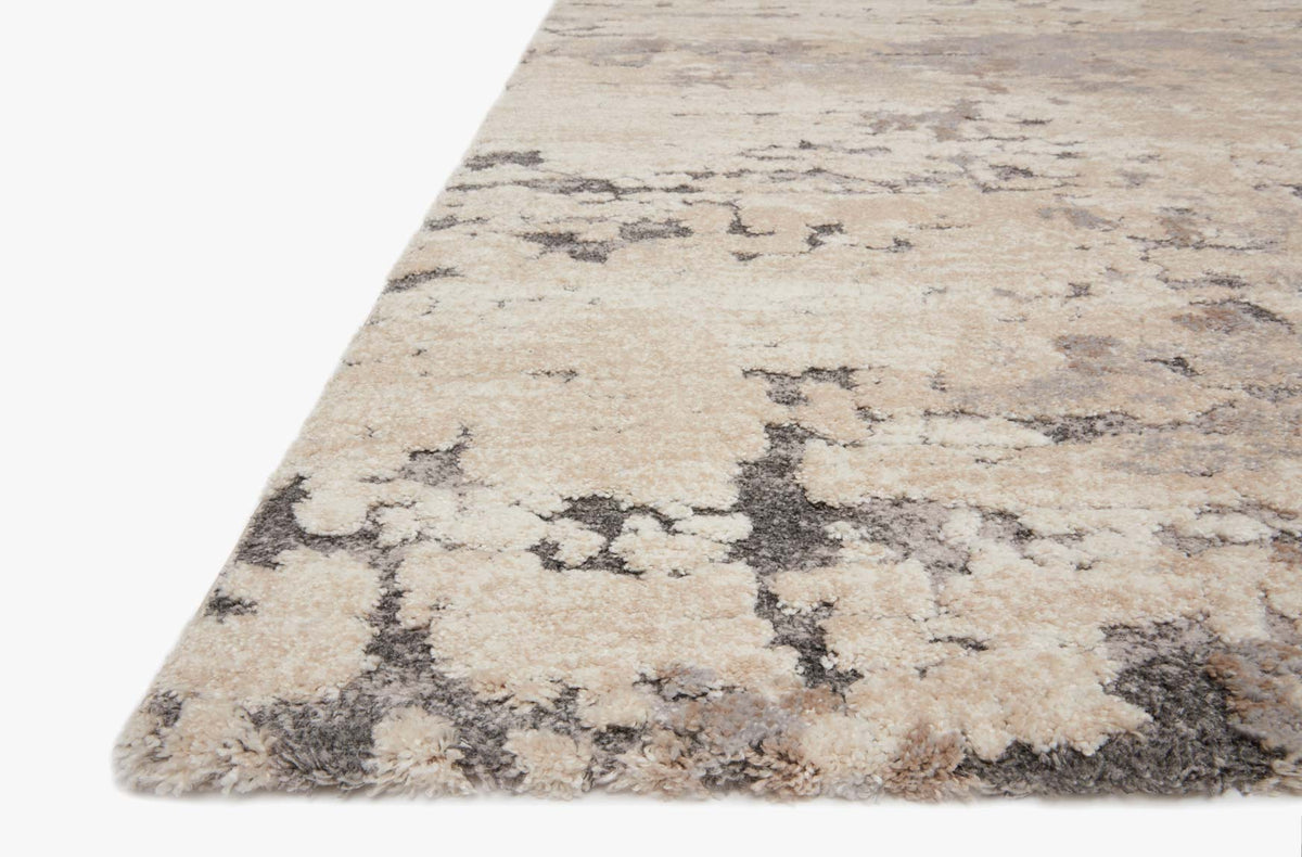 Taupe and grey transitional power-loomed rug corner with distressed abstract motif, low pile