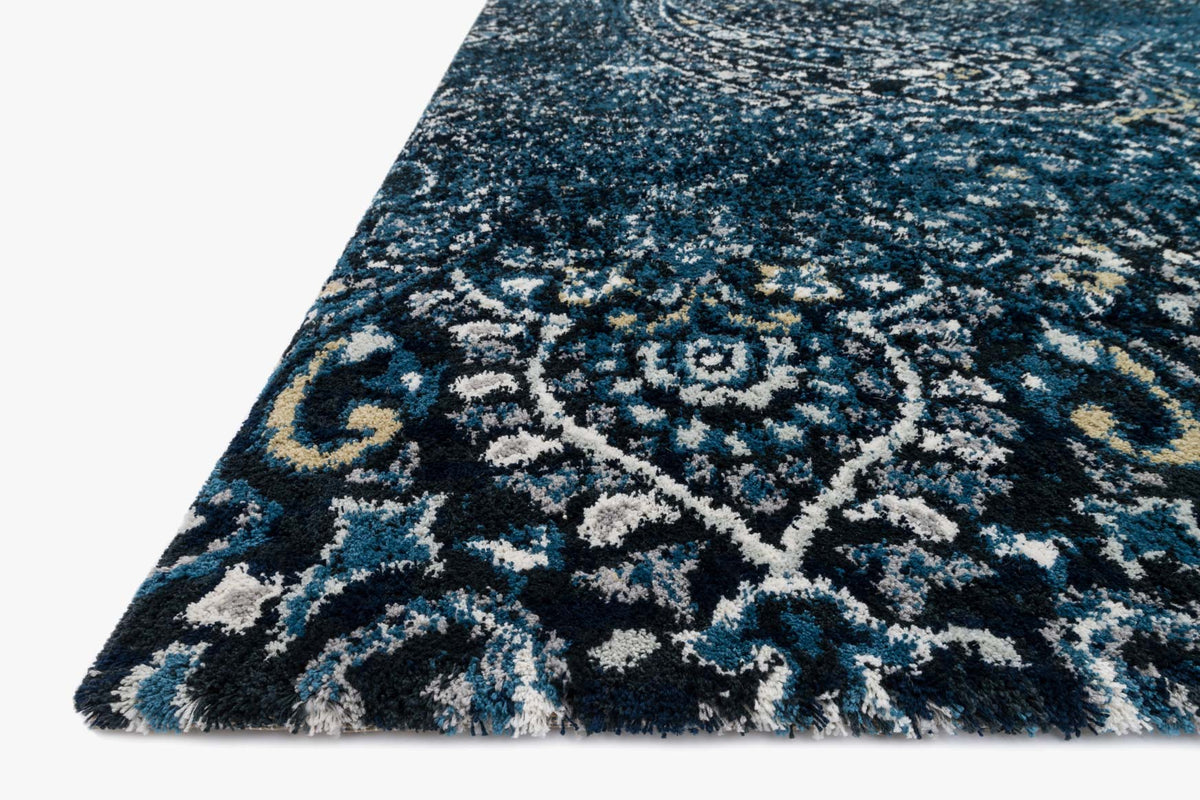 Transitional power-loomed rug corner view, navy base with light indigo motif
