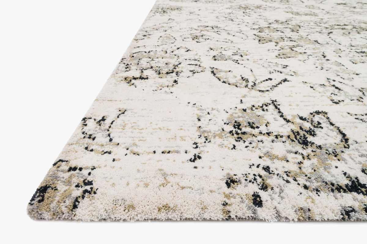 Ivory rug corner with black abstract floral motif and textured pile, power-loomed