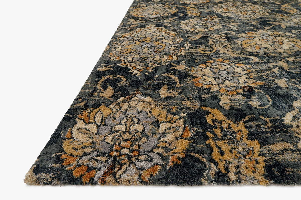 Charcoal power-loomed rug corner detail with swirling damask motifs in tan and gold
