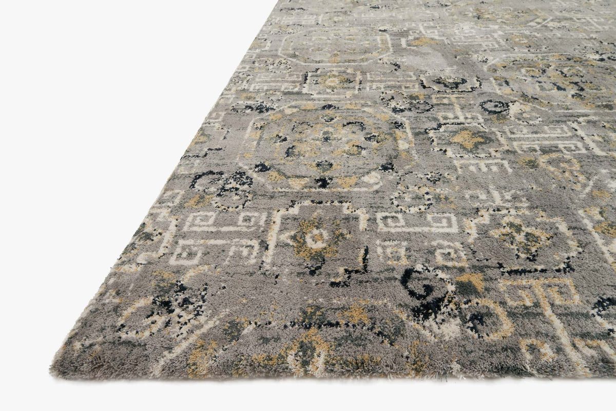 Grey power-loomed rug with distressed geometric blocks and ornate motifs