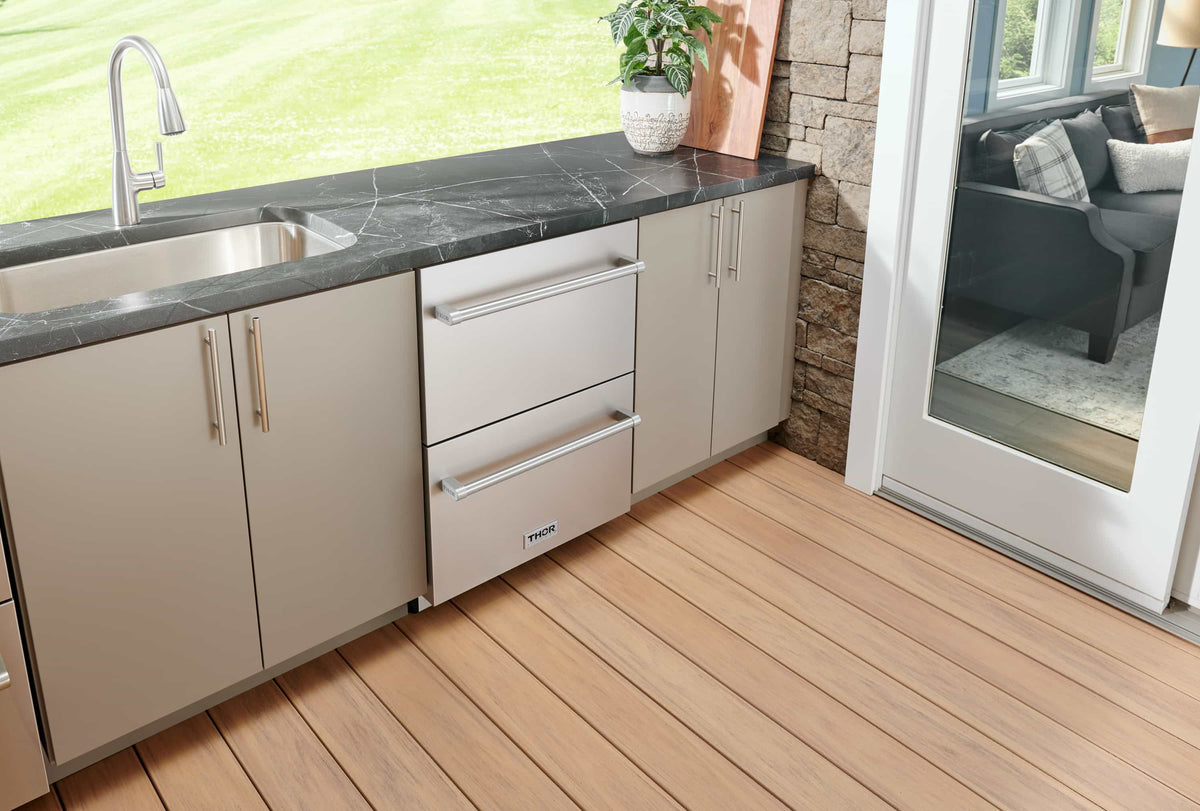 Stainless steel built-in undercounter double drawer refrigerator installed outdoors, drawers closed