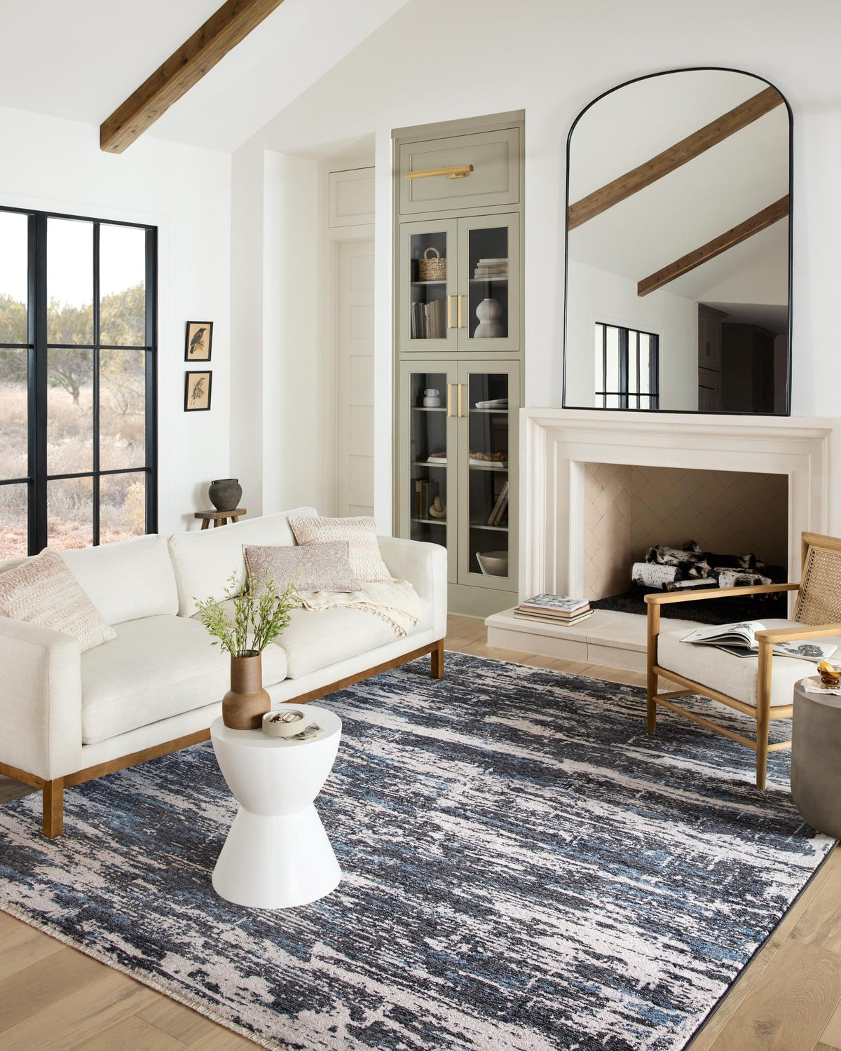 Charcoal and dove rectangular area rug with distressed stripe pattern in living room.