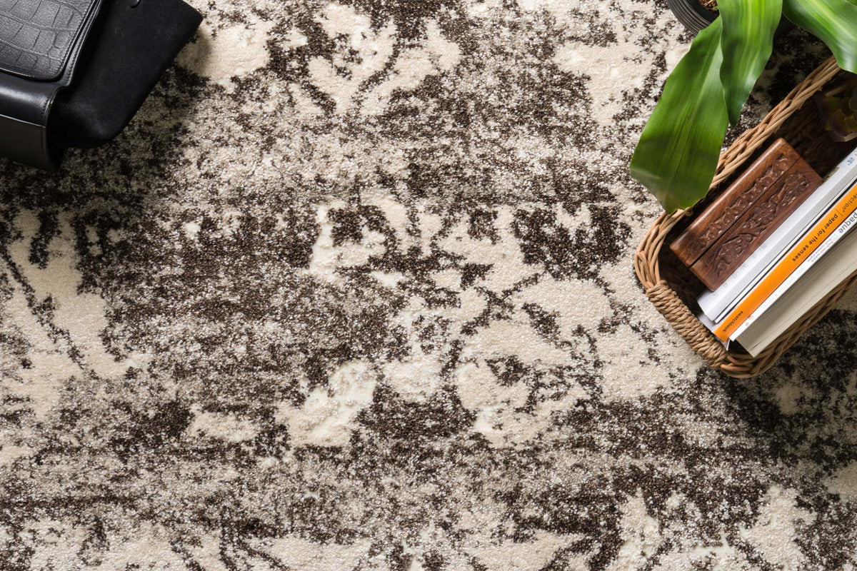 Contemporary power-loomed rug close view, distressed abstract design in mocha and ivory