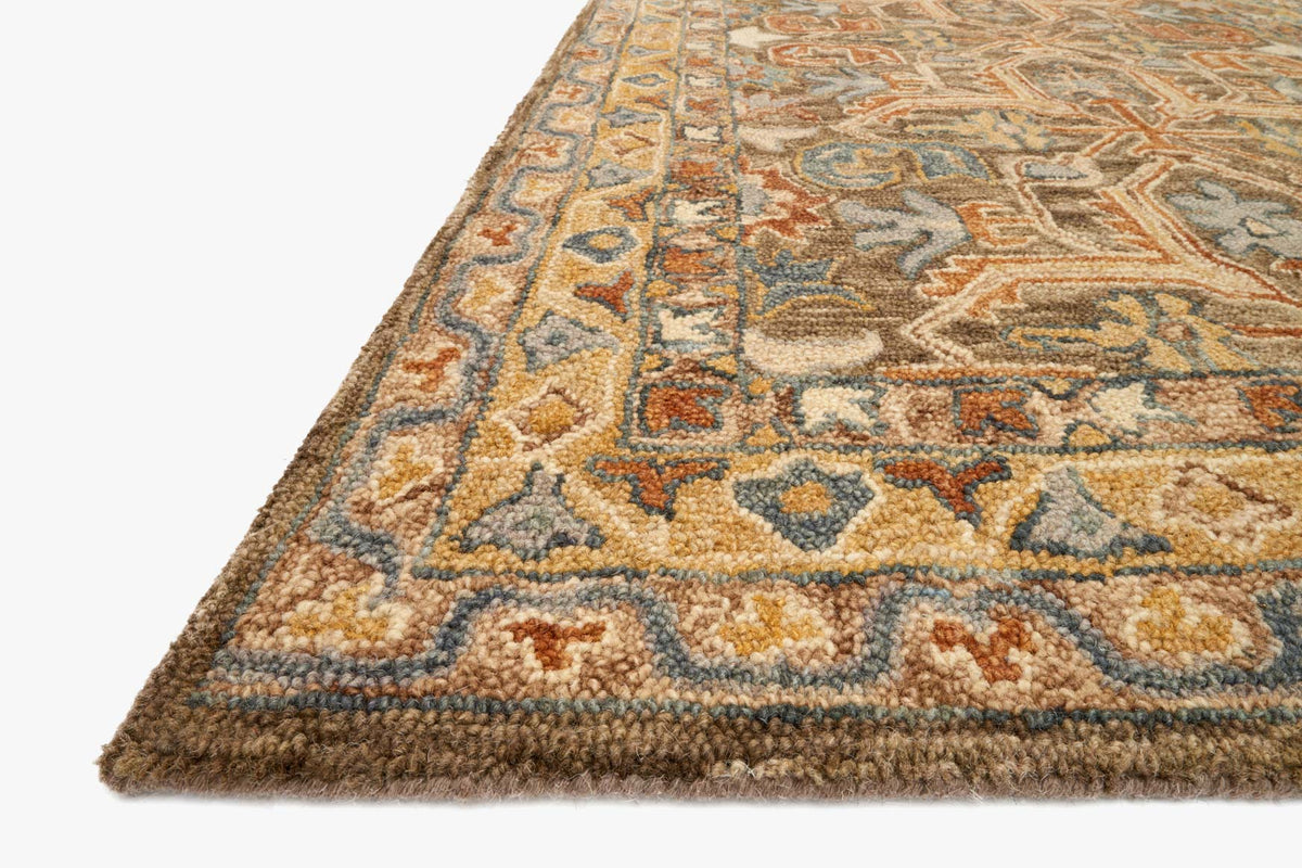 Traditional hooked rug corner close-up with geometric motifs, tan, teal, and muted rust