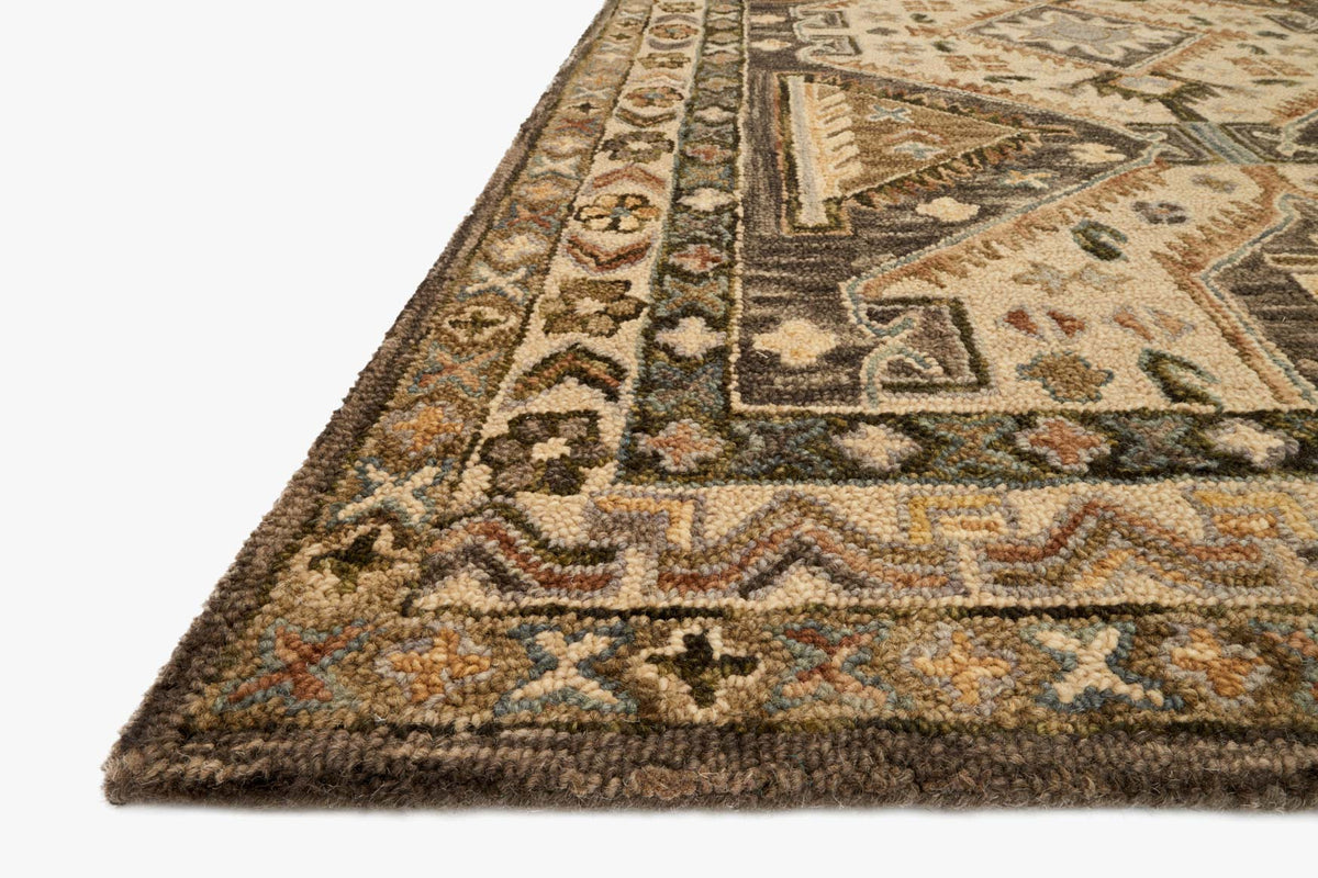 Traditional hooked rug corner, detailed geometric pattern with textured pile in beige and dark tones
