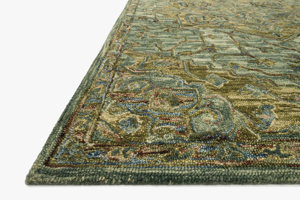 Traditional hooked rug corner close-up with dark green texture and tobacco accent border