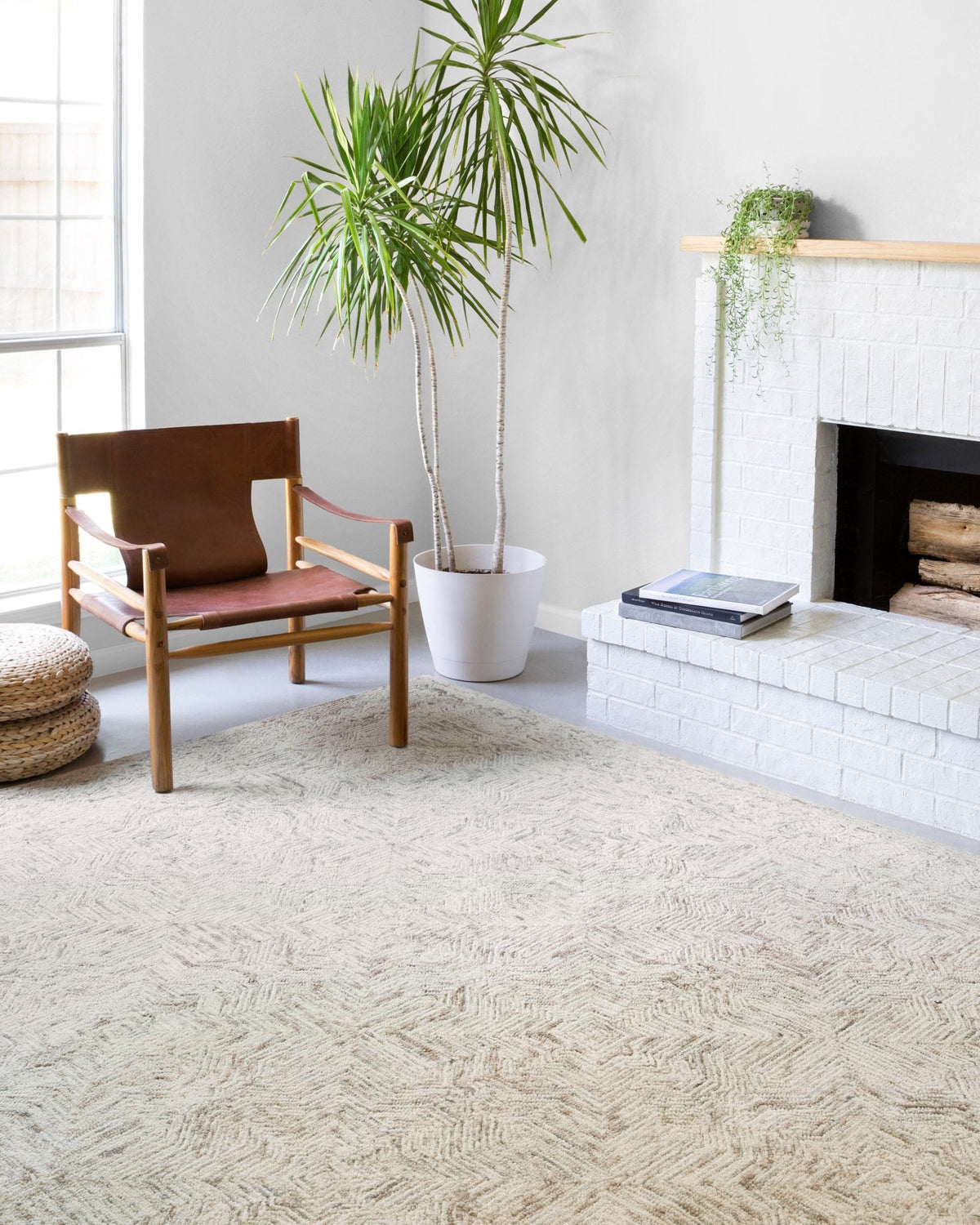 Neutral geometric rug with raised loop texture and zigzag pattern in light beige