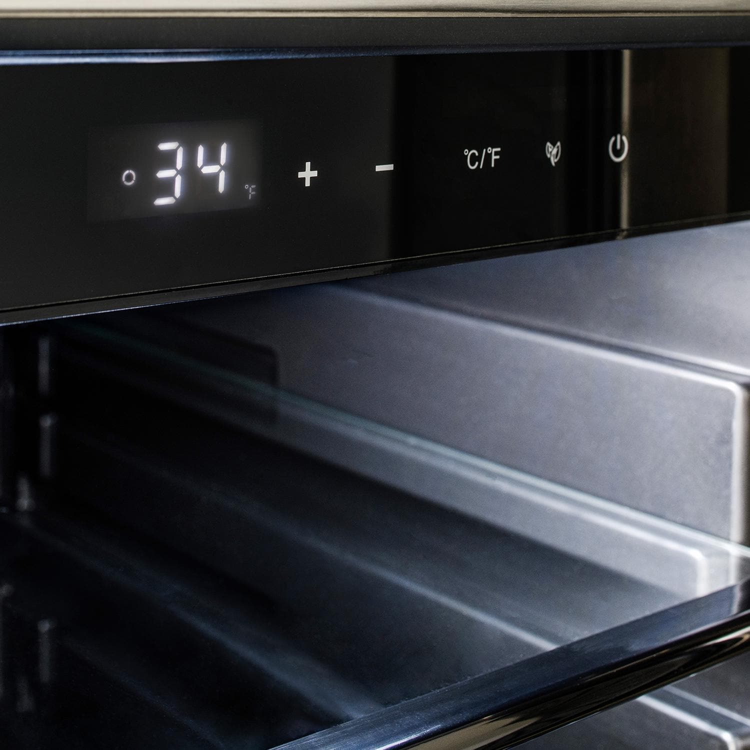 Compact refrigerator beverage center control panel with digital temperature display and icons