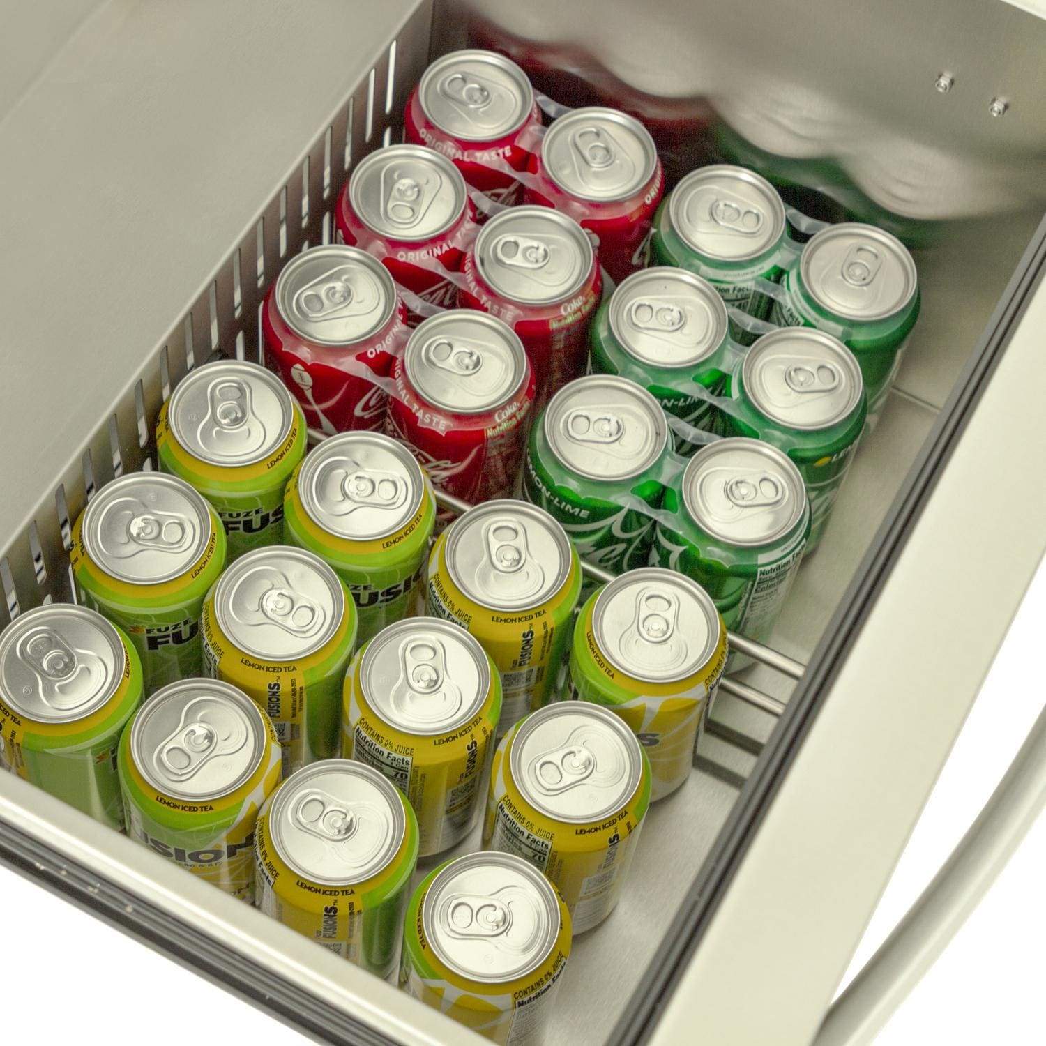 Open outdoor refrigerator drawer packed with green, red, and yellow soda cans