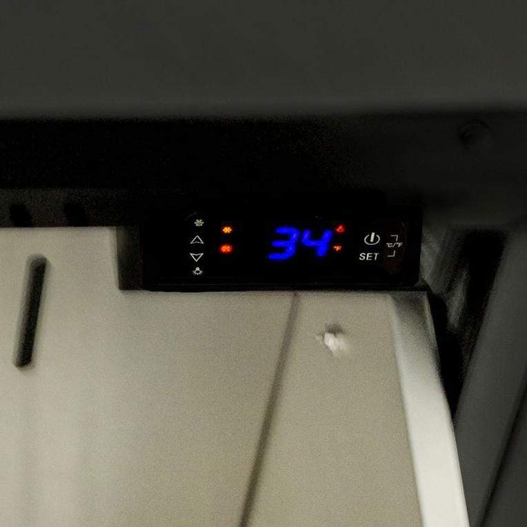 Outdoor refrigerator control panel with digital temperature display reading 34° F