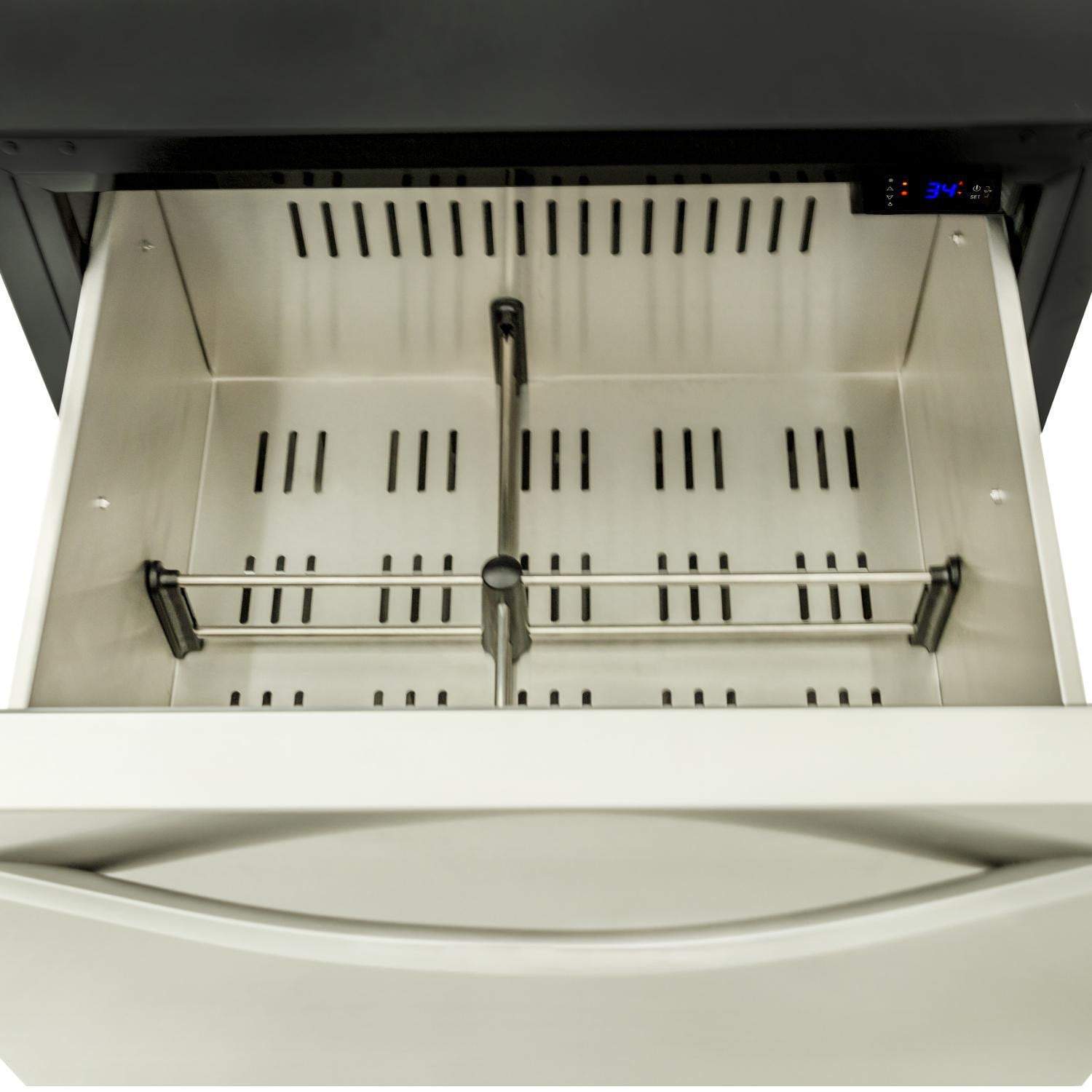 Open outdoor refrigerator drawer interior with wire rack rails