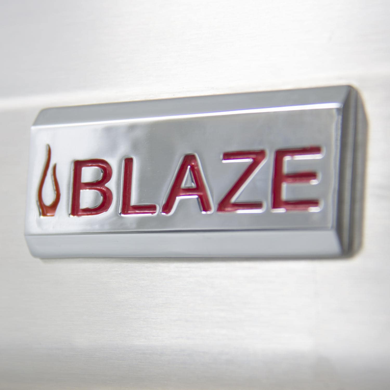 Stainless steel grill front badge with red and blue Blaze logo