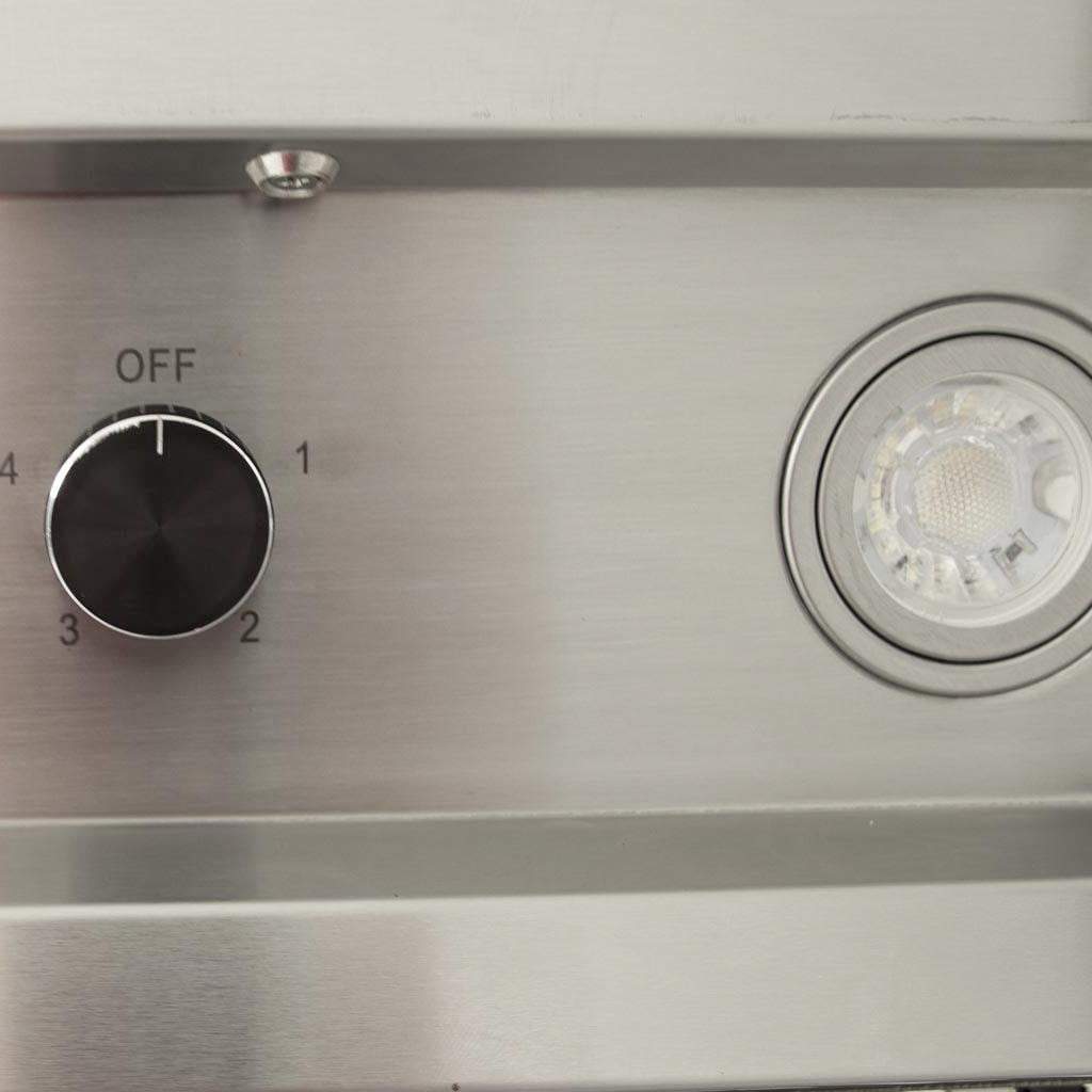 Stainless steel vent hood control area with knob dial and indicator light