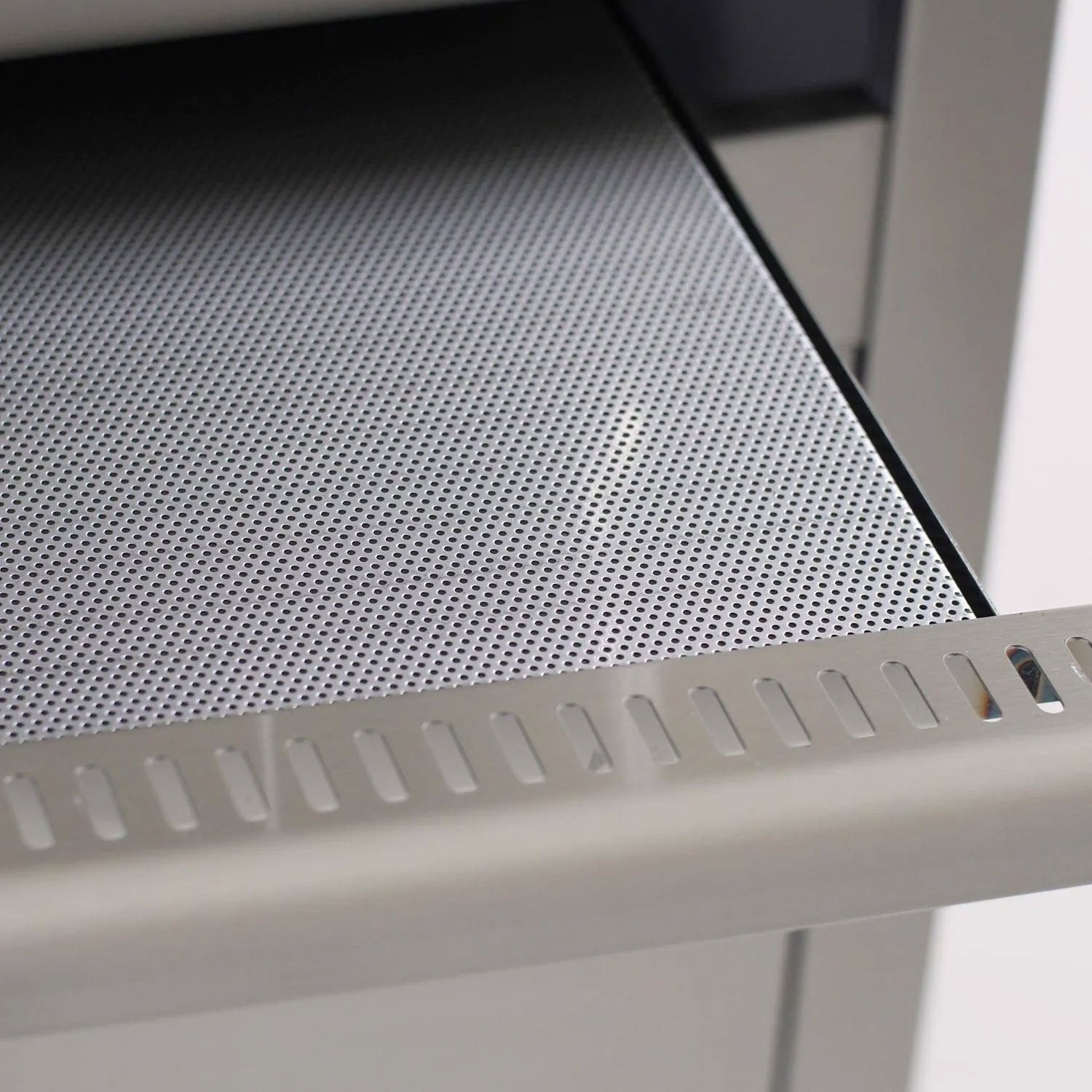 Perforated drip tray flame guard with mesh texture and front vent slots