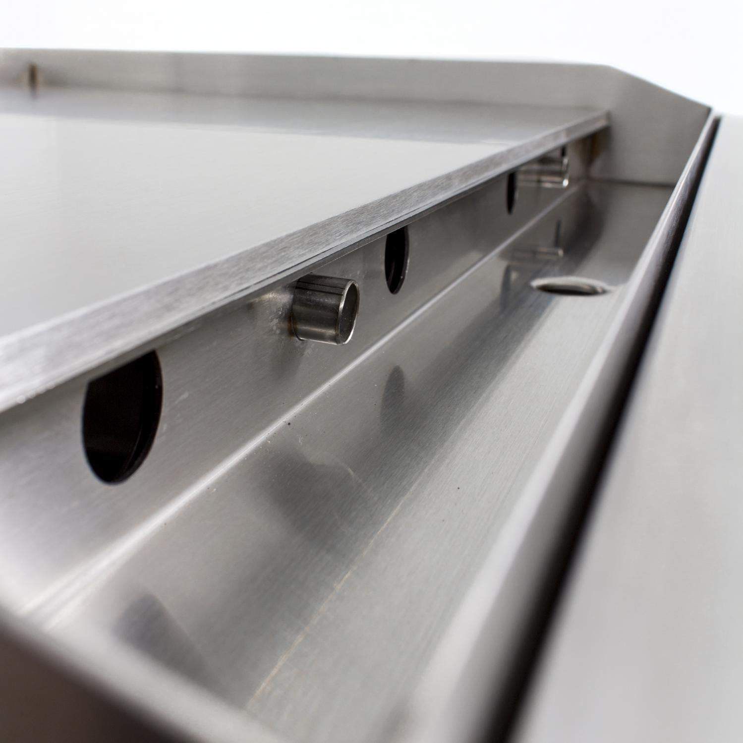 Stainless steel grill side burner housing with flame port openings