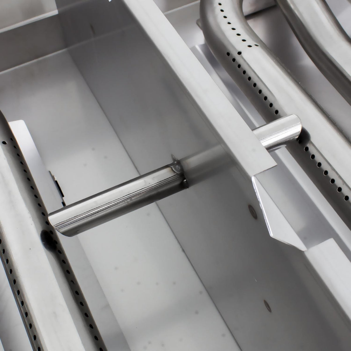 30-inch natural gas griddle interior with perforated burner tubes and support bar