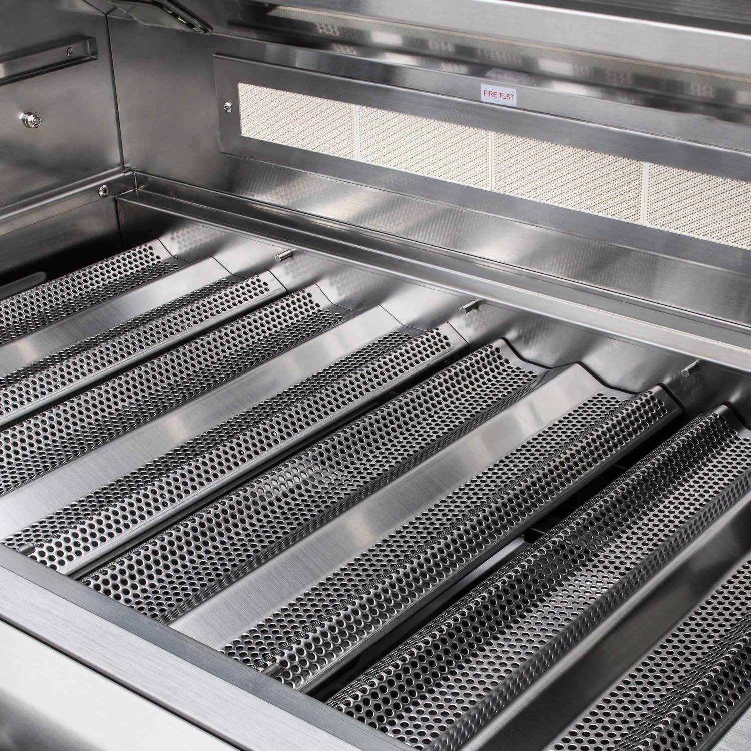 Open stainless grill interior with perforated flame tamers and cooking grates