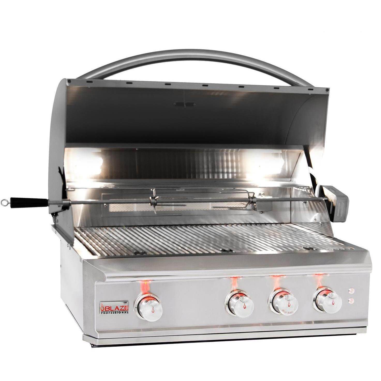 Stainless steel built-in propane grill with hood open, grates and burners visible