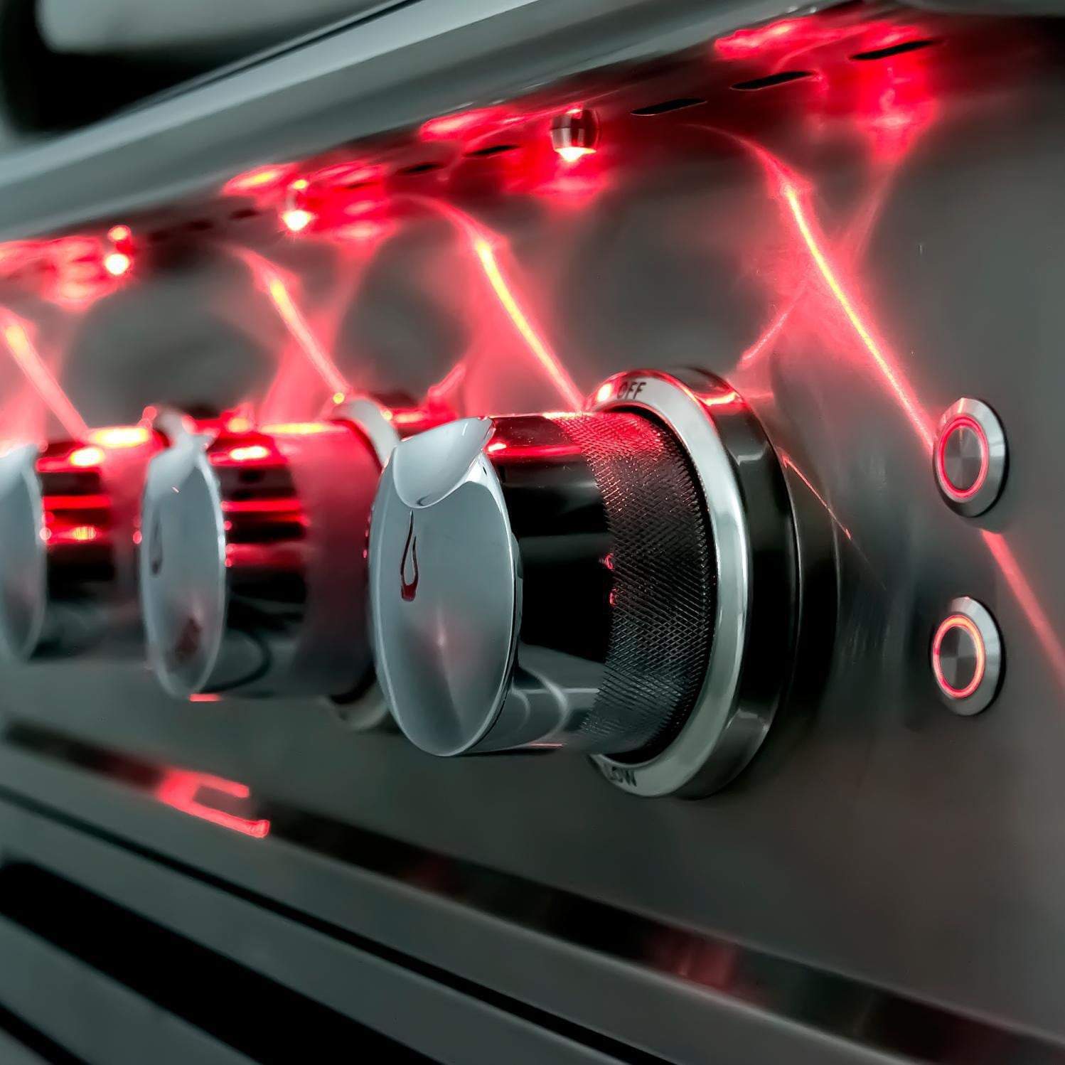 Stainless steel grill control knobs with orange/red indicator light on burner panel