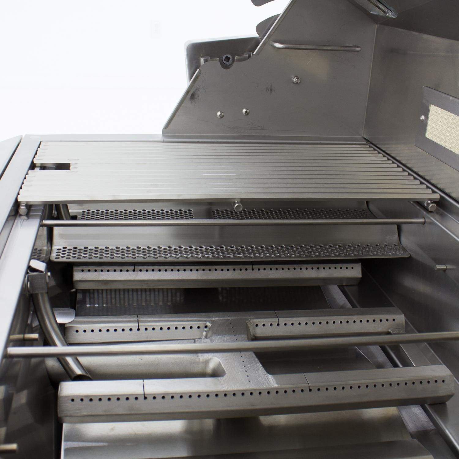 Open grill firebox with stainless burner tubes and cast warming rack above