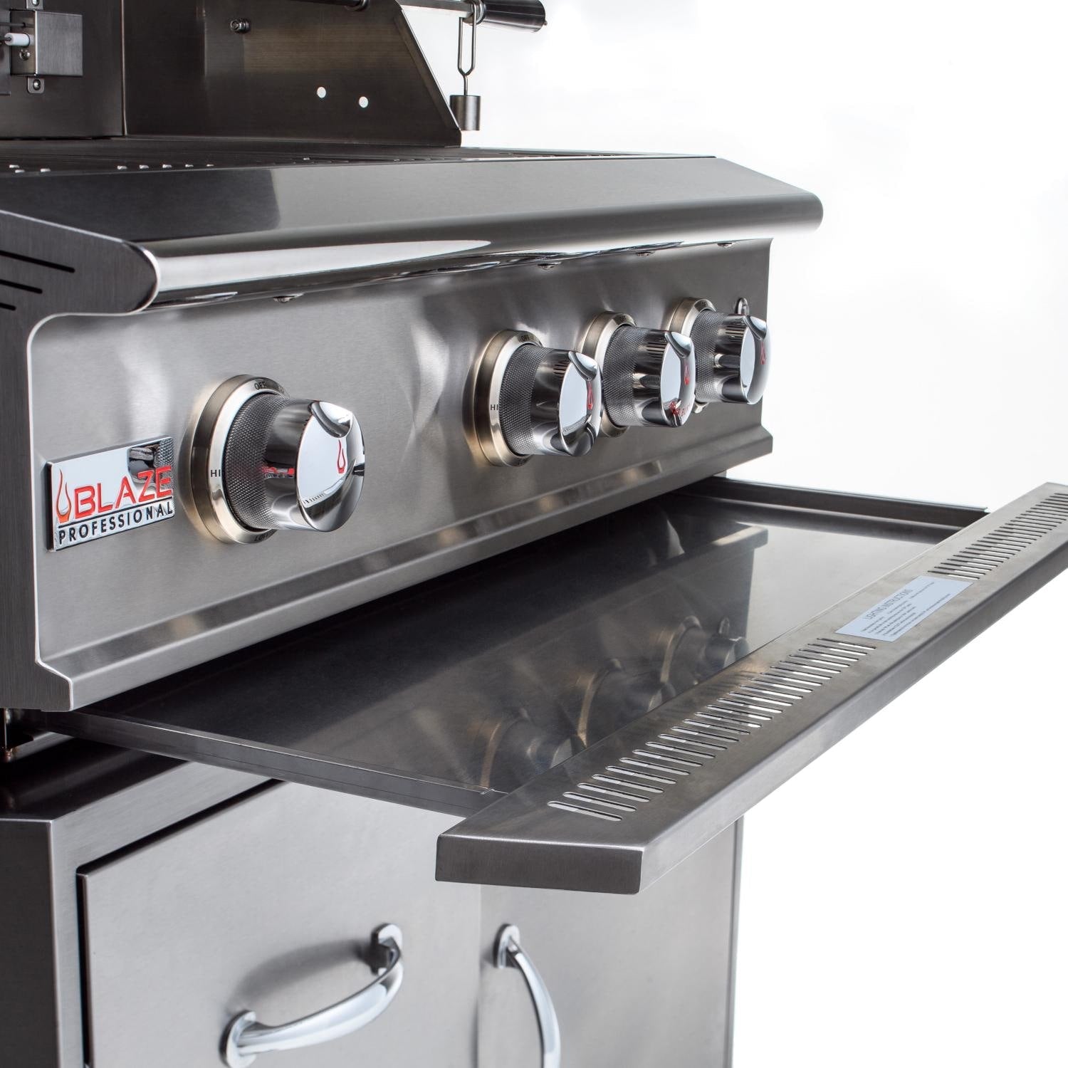 Front control panel of stainless gas grill with four knobs and Blaze Professional logo