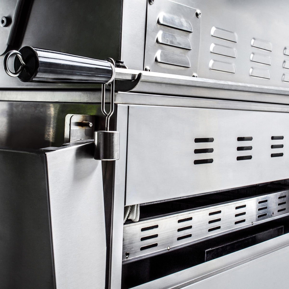 Stainless steel side panel with ignition and control knobs