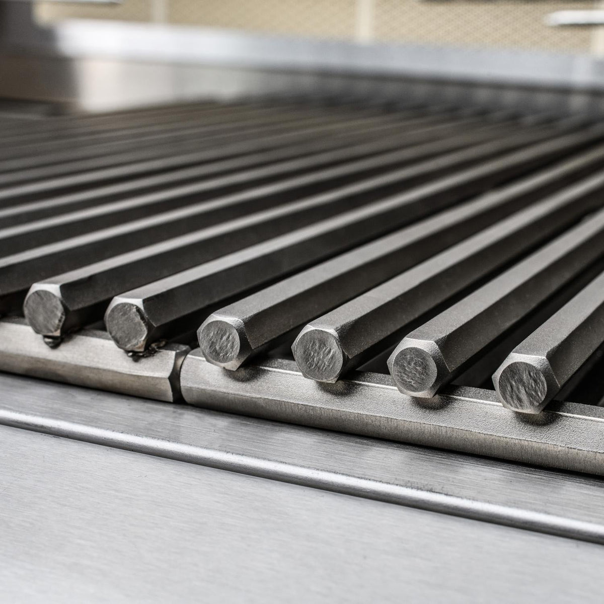 Stainless steel grill grates with thick cooking bars and rounded end caps