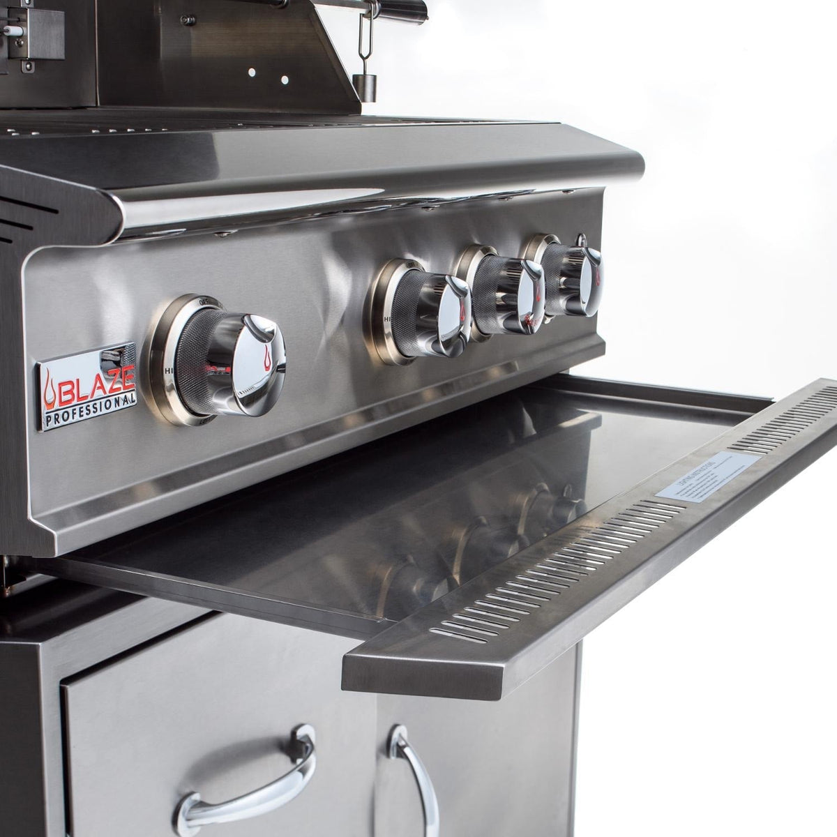 Stainless steel grill front control knobs and open lower storage cabinet