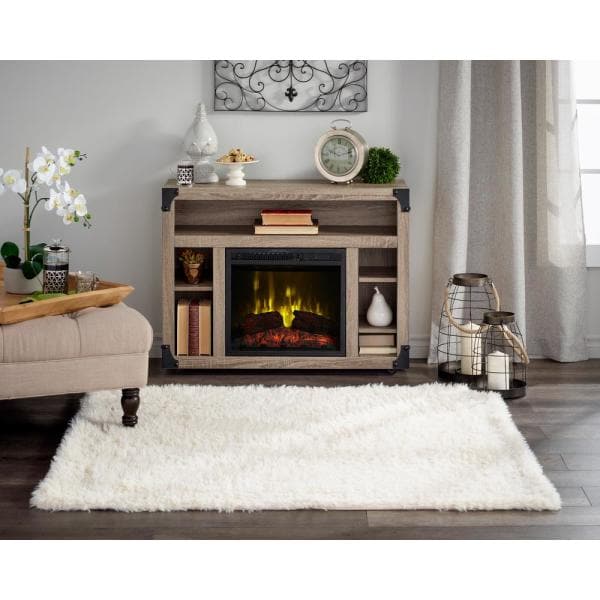 Distressed oak media console with electric fireplace insert and side storage shelves
