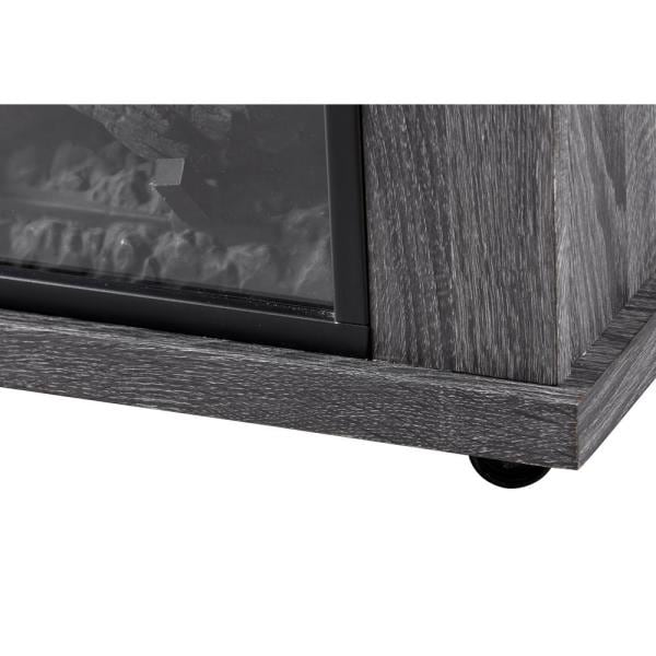 Charcoal oak fireplace mantel corner detail with black firebox opening and front trim