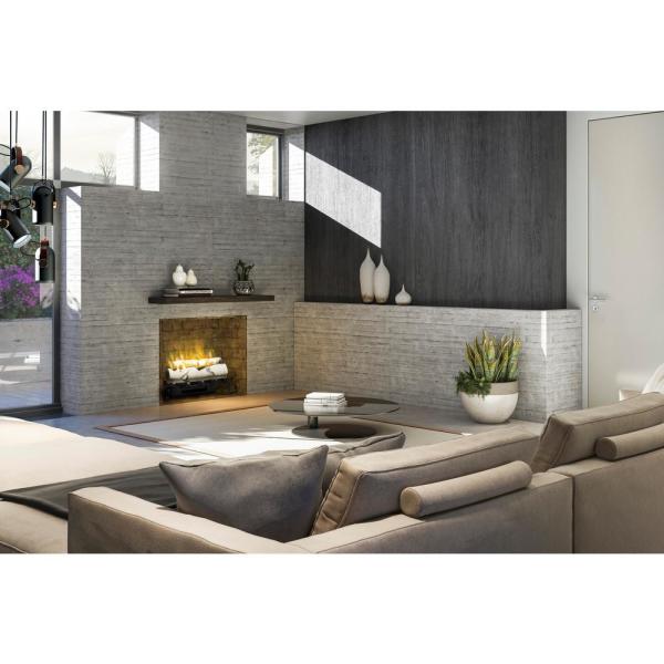 Electric firebox insert with birch log flames in a recessed fireplace surround