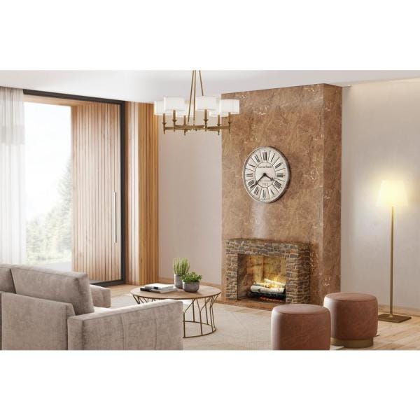 Electric fireplace insert with birch-style log set and glowing embers inside stone surround