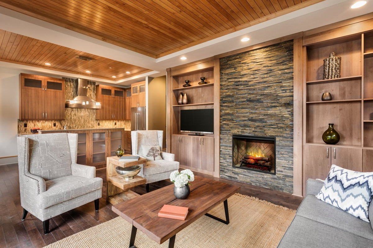 Built-in electric firebox in stone wall with burning log set and warm flame glow