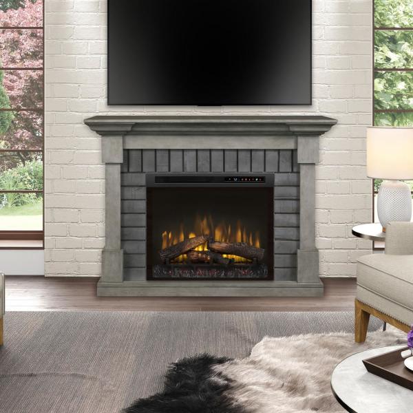 Smoke Stak grey mantel with 28-inch electric fireplace and glowing log fire