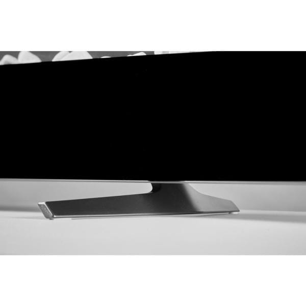 Black wall-mounted linear electric fireplace with glowing flame effect and ember bed
