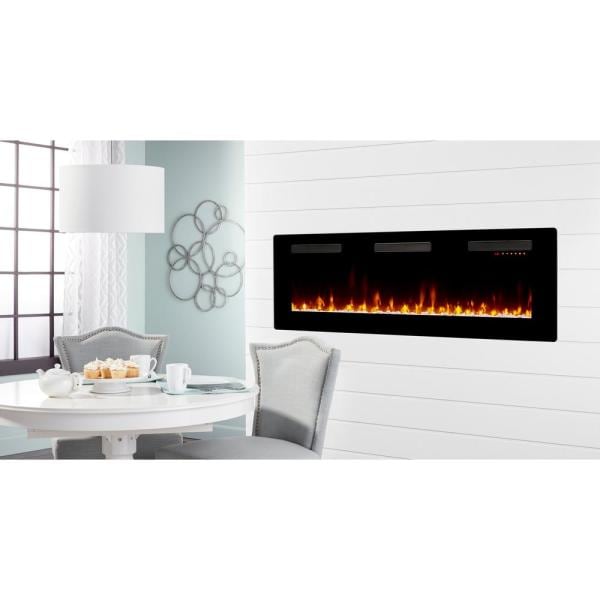 Black built-in linear electric fireplace installed in a white wall with flame panel
