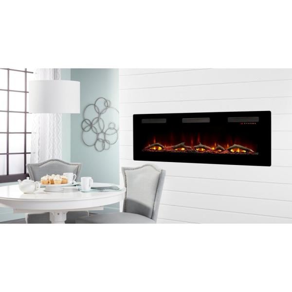 Black linear electric fireplace on a white wall with flame display in a room