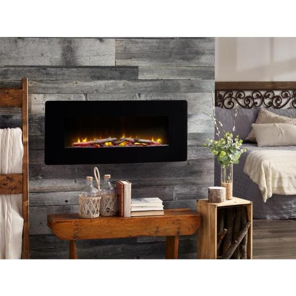 Black 42-inch linear electric fireplace set into a wall with flame glow