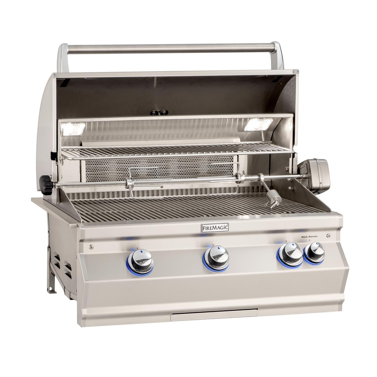 Fire Magic gas grill with open lid, interior cooking grate, and front control knobs