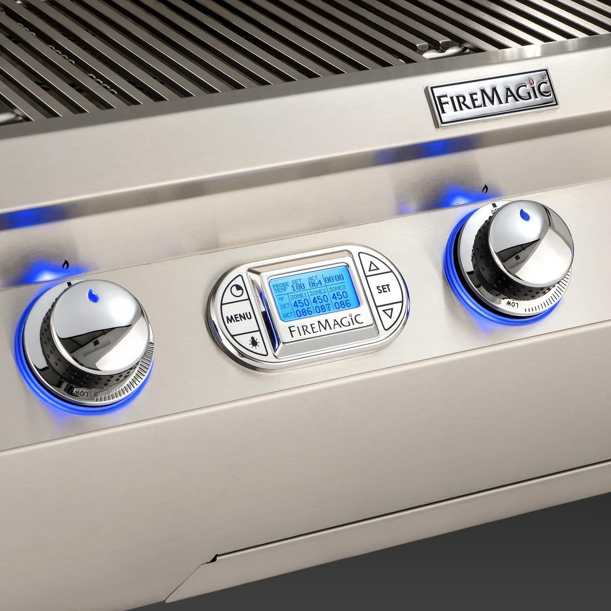 FireMagic control panel with blue-lit burner knobs and digital menu display